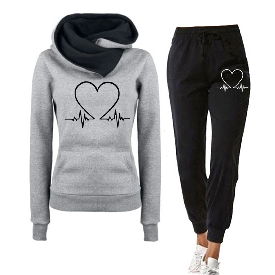 comfortabel trainingspak voor dames joggingpas met hart afgebeeld bestaande uit hoodie trui en broek dames