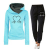 comfortabel trainingspak voor dames joggingpas met hart afgebeeld bestaande uit hoodie trui en broek dames